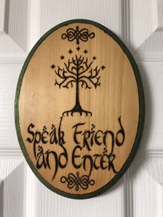 a wooden sign that says speak friend and enjoy