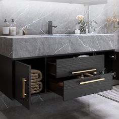 a bathroom vanity with marble counter top and drawers in black finish, gold handles on both sides