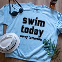 Dive into style with our "Swim Today, Worry Tomorrow" sweatshirt! Designed for swimmers, swim moms, and poolside lovers, this vintage-inspired oversized sweatshirt is the perfect blend of comfort and charm. Whether you're gifting it as a swim team shirt, swim teacher gift, or treating yourself, this retro college-style design makes it a must-have for anyone who lives for the water. Crafted from soft, high-quality fabric, this cozy fall sweater is ideal for layering after a swim or lounging by the pool. The bold simple text design in classic college font adds a fun, motivational vibe to your wardrobe. Whether you're looking for swimming gifts or a stylish swim shirt for everyday wear, this piece is a versatile addition to any collection. Perfect as a gift for swimmers, this sweatshirt is av Swim Team Shirt, Swim Teacher Gifts, Swim Teacher, Swim Team Shirts, Cozy Fall Sweater, Swimming Team, Coach Shirt, Cozy Sweaters Autumn, Swim Mom