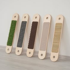 four wooden handles with grass on them