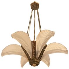 a chandelier with white flowers hanging from it's center point, on a white background