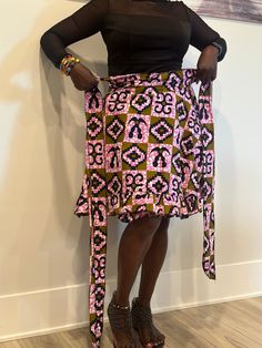 Embrace Africa's bright energy with this gorgeous Ankara wrap skirt. This adaptable item, made of high-quality Ankara cloth, allows for unlimited style options. Whether you like the casual elegance of a maxi, the whimsical appeal of a mini, or the graceful flow of a midi, our wrap skirts are suitable for every style and occasion. The wrap shape offers a great fit for all body types, and the bright Ankara prints lend an exotic flare. Our Ankara wrap skirts are the definition of easy style, whether on a casual day or at a formal event. Discover the charm of African fashion and upgrade your wardrobe now. Features ✨Wrap style, versatile length options, vibrant Ankara prints, comfortable fit. ✨Perfect for: Casual wear, special occasions, office attire. ✨Pair with a simple top and statement acce Multicolor Fitted Long Wrap Skirt, Fitted Multicolor Tiered Wrap Skirt, Fitted Multicolor Ruffled Mini Skirt, Multicolor Long Lined Wrap Skirt, Multicolor Tiered Wrap Skirt With Lining, Multicolor Tiered Lined Wrap Skirt, Fitted Multicolor Lined Wrap Skirt, Multicolor Relaxed Flared Wrap Skirt, Flowy Multicolor Tiered Wrap Skirt