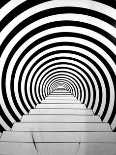 an abstract black and white tunnel with lines going through it