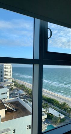 the view from an apartment window looking out at the beach and ocean in miami, florida