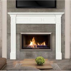 a living room with a fire place and television above the fireplace, in front of a wall mounted flat screen tv