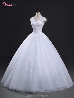 a white wedding dress on a mannequin