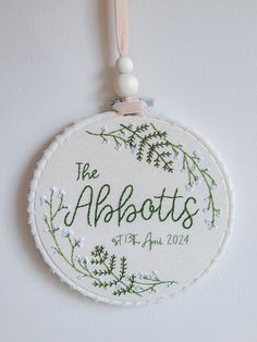 The perfect wedding gift - a custom hoop with the happy couple's name and wedding date. Framed with Gypsophilia and Ferns, a beautiful floral keepsake they can hang in their home. It's the perfect present for an anniversary especially that second cotton anniversary as 100% cotton is used for all hoops. There are 2 hoop sizes to choose from; 6" & 8". Hand embroidered on 100% cotton fabric. Please note as each one is made to order they may vary slightly from photos. **Leave a note in the descripti Embroidery For Wedding, Wedding Gift Embroidery Ideas, Wedding Gift Painting, Wedding Gift Embroidery, Wedding Date Embroidery, Wedding Present Embroidery, Embroidered Wedding Gifts Couple, Wedding Gifts Painting, Embroidery Love Couple Anniversary Gifts