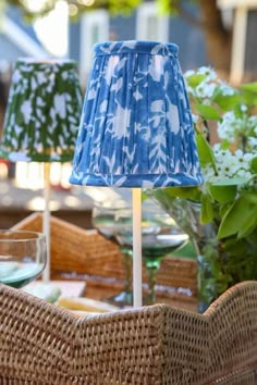 two blue lamps sitting on top of a table