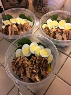 three plastic containers filled with food on top of a counter