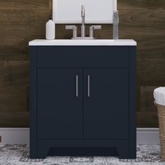 a bathroom vanity with a sink and mirror on it's side in front of a wood paneled wall