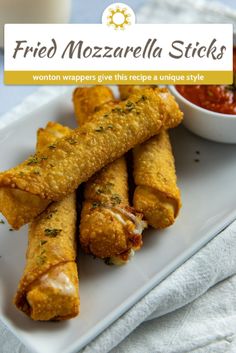 fried mozzarella sticks on a plate with dipping sauce