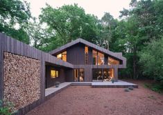 the house is surrounded by trees and rocks