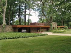 a house in the middle of a lush green park