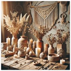 a table topped with vases filled with lots of different types of flowers and candles