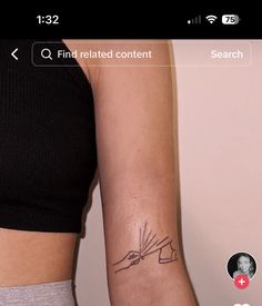 a woman's arm with a tattoo on it that reads find related content search