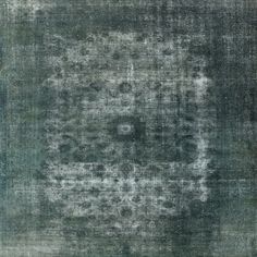 an area rug that has been worn and faded