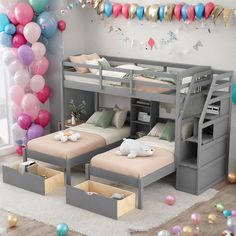 a room with two bunk beds and balloons