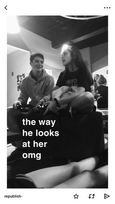 two people sitting on a couch with the caption'the way he looks at her omg '