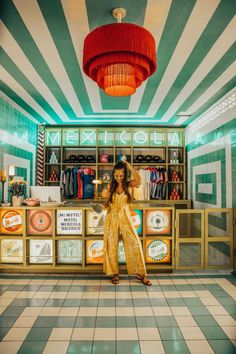 a woman standing in front of a store counter