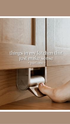 a woman's feet are shown under a cabinet door with the words, things in my kitchen that just make sense print one