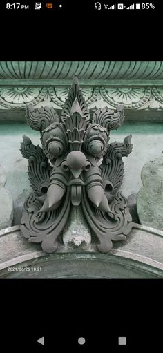 an ornate design on the side of a building