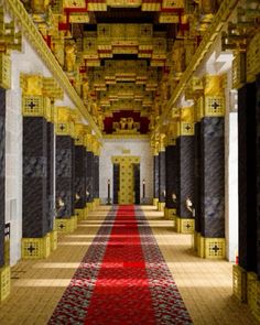 a long hallway with red carpet and gold decorations