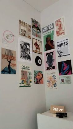 there are many posters on the wall in this room and it is very nice to see