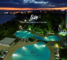 an aerial view of a resort at night with the ocean in the background and text that reads live