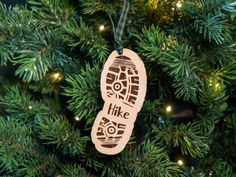 a wooden ornament hanging from a christmas tree with the words love hike on it