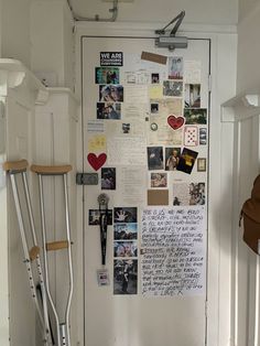 a white door covered in lots of pictures and writing on the wall next to a stair case