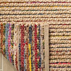 multicolored braided rugs on the floor