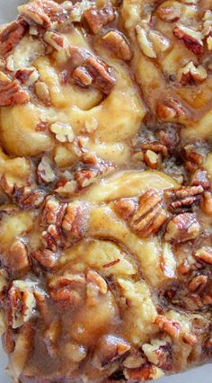 a close up of a pastry with nuts on it