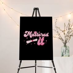 an easel with a sign that says,'married it'in pink lettering