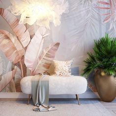 a white bench sitting in front of a wall with flowers and plants on top of it