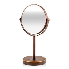 an image of a round mirror on a stand