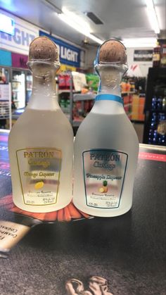 two bottles of fatton's orange custard are sitting on the counter