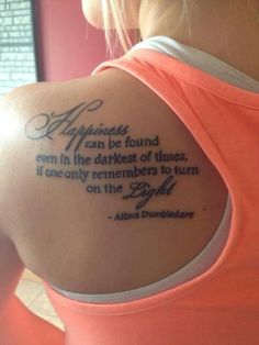 the back of a woman's arm with a quote on it