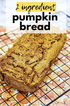 a loaf of pumpkin bread sitting on top of a cooling rack with text overlay