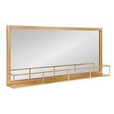 a large mirror sitting on top of a wooden shelf