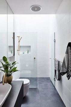 a modern bathroom with black and white decor