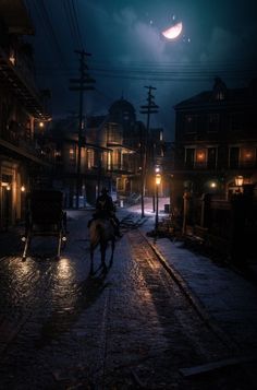 a person riding a horse down a street at night with lights on and buildings in the background