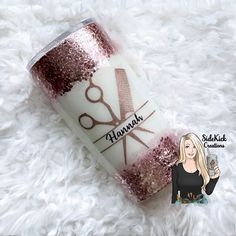 a coffee cup with pink glitter on it and a woman holding a glass in her hand