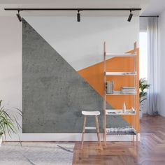 an orange and grey wall mural in a living room