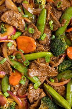 beef and vegetables stir fry together in a skillet