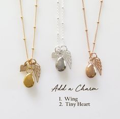 three different necklaces with angel charms on them and the words add a charm above them