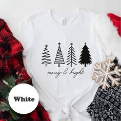 Merry & Bright Christmas Trees Sweatshirt, Christmas Sweatshirt,Christmas Party Shirt,Holiday Xmas Tee, Winter Trendy Shirt,Holiday T-shirt  Welcome to my store. I am so glad to see you here. -We have 3 different tshirt brand that we use, if you only want one particular brand please ask the seller for availability, if you do not ask we will ship the available brand. I make my t-shirts with love. I am sure you will like them. Please make sure you check the size chart before ordering. Shirts are made with high-grade, commercial vinyl and pressed with a commercial grade heat press. Colors on chart may differ slightly in person depending on screen. The order-process: * Click add to cart. * Please click the "proceed to Check Out" button. * Finally, your order will be ready to ship 1-3 business White Letter Print Top For Holiday, White Letter Print Tops For Holiday, White Graphic Tee For Winter, White Graphic Print Shirt For Holiday, White Christmas T-shirt Gift, White Christmas Graphic Tee Tops, White Christmas Graphic Tee, White Christmas Letter Print Tops, White Winter Holiday T-shirt