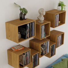 a wall mounted shelf filled with lots of books