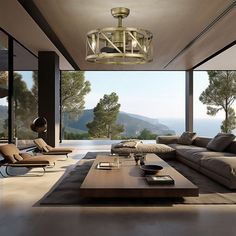 a modern living room with large windows overlooking the mountains