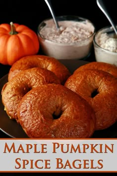 maple pumpkin spice bagels on a plate with spoons and dip in the background