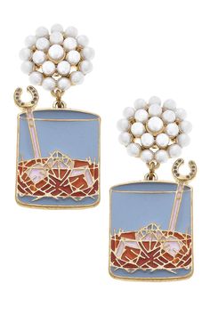 Add some southern charm to your wardrobe with our Kentucky Bourbon on the Rocks Enamel Earrings! Perfect for any equestrian or Derby party, these blue and amber earrings are sure to make a statement and elevate any outfit. Sip on style with these adorable accessories. Kentucky Bourbon, Derby Party, Amber Earrings, On The Rocks, Enamel Earrings, Southern Charm, Base Metal, Gold Plating